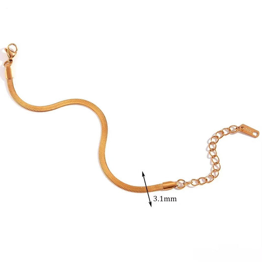 A gold herringbone chain bracelet with a lobster clasp and extension chain, shown on a white background with a dimension marker indicating 3.1mm width.