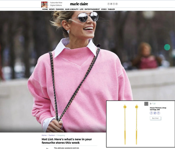 A woman outdoors wearing a bright pink sweater and gold dangle earrings, with a magazine-style inset showing the gold Drop earrings up close. The scene includes a visible person and real environment, so this is Lifestyle rather than Product/Packaging.