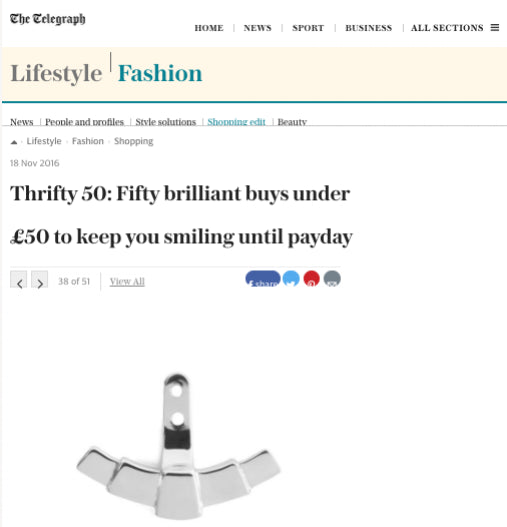 A screenshot of a The Telegraph article under the Lifestyle | Fashion section, featuring a silver Fan Ear Jacket with a curved, fan-lie design on a white background. 