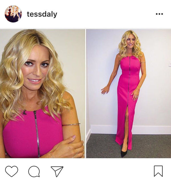 A split-screen social media post showing a woman, Tess Daly,  modelling a sleeveless bright pink dress. The left panel is a close-up of her smiling and wearing the dress, and the right panel shows her full body in a long pink gown with a front slit and black heels, standing indoors against a plain light wall. She wears our Rise hand chain