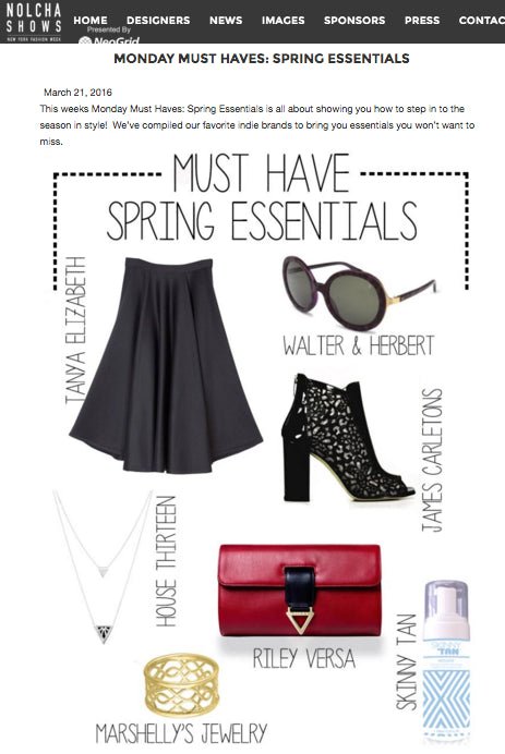 A promotional graphic titled 'Monday Must Haves: Spring Essentials' from Nolcha Shows, featuring a black pleated skirt, black lace-up ankle boots, black sunglasses, a red leather clutch, a gold ring, and a blue-tinted spray bottle, each labeled with a designer name. Features the silver Rise Drape necklace to the left