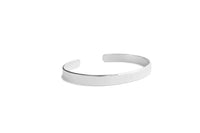 Polished silver open bangle on white background. Foundation plane bangle 