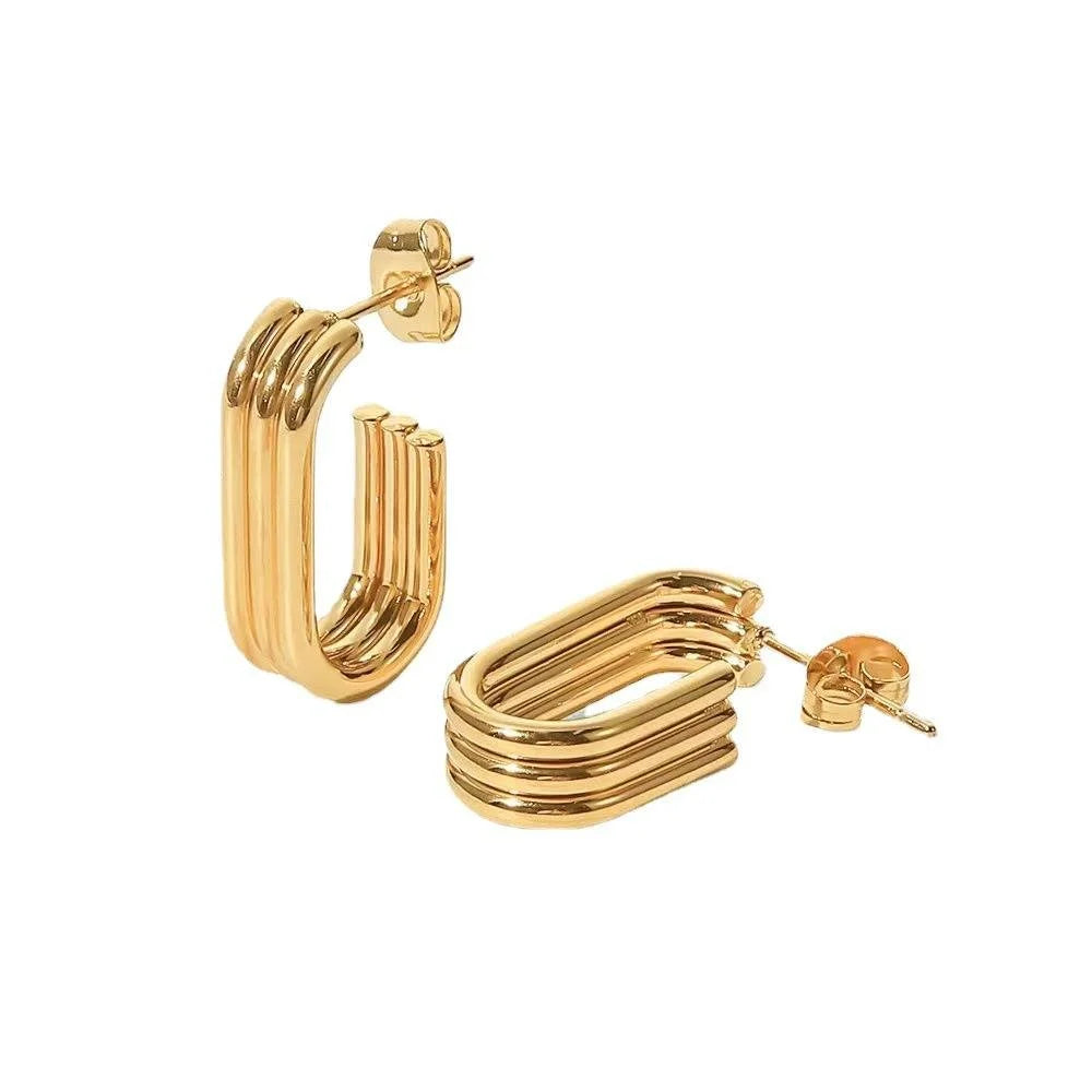 Gold Trio hoop earrings on a white background