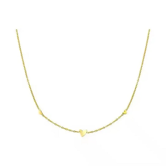 A delicate yellow gold chain necklace featuring a small, polished heart pendant at the center and one at either side, displayed against a solid white background.