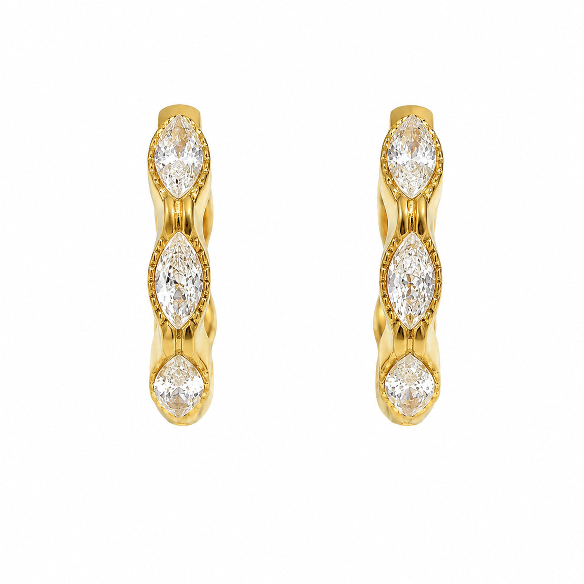 A pair of gold Luna  huggie hoop earrings, each featuring three marquise-cut cubic zirconia crystals in a vertical arrangement with a delicate beaded border, set against a plain white background.