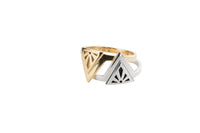 A gold rise ring and a silver rise ring stacked together on a white background