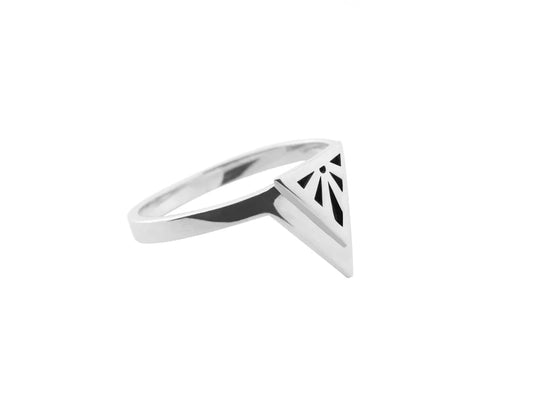 A silver ring with a geometric triangular design featuring a black art deco sunburst motif on the front, set against a plain white background.