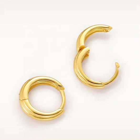A pair of gold-plated stack huggie earrings on a clean white background.