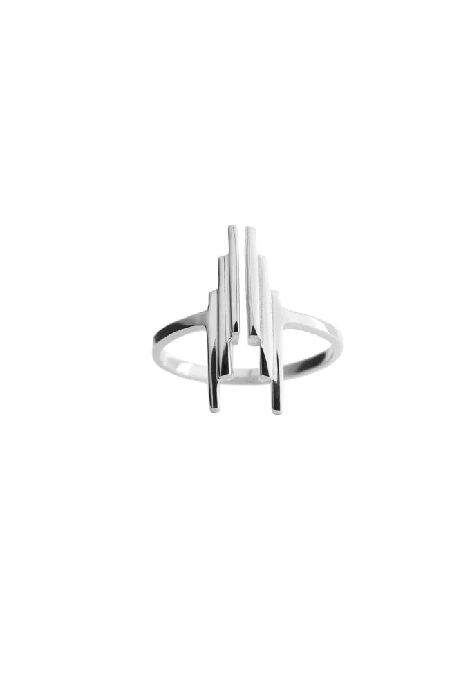 A minimalist silver ring with a geometric, gradated art deco Stack design, shown on a plain white background.