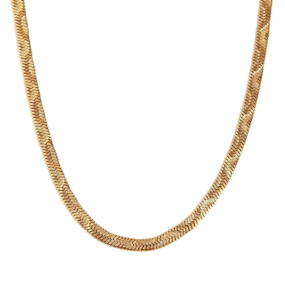 A gold wave snake chain necklace with a textured, raised wave pattern, shown against a plain white background.