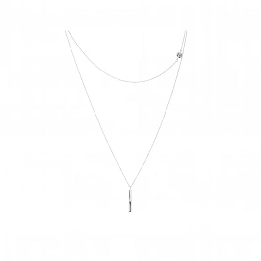 A delicate silver necklace featuring a long chain with a slim vertical bar pendant at the bottom and a small round disk detail on the upper right side, shown against a plain white background.