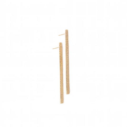 A pair of long, thin gold bar earrings with a textured finish and post backs, shown on a plain white background.