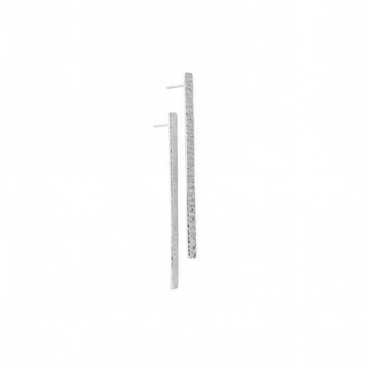 A pair of long, thin gold bar earrings with a textured finish and post backs, shown on a plain white background.
