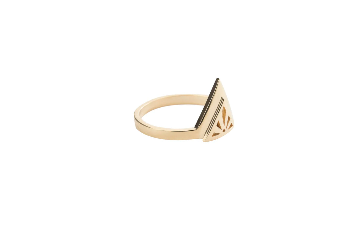 A gold Rise ring with a triangular geometric design on the band, shown against a plain white background.