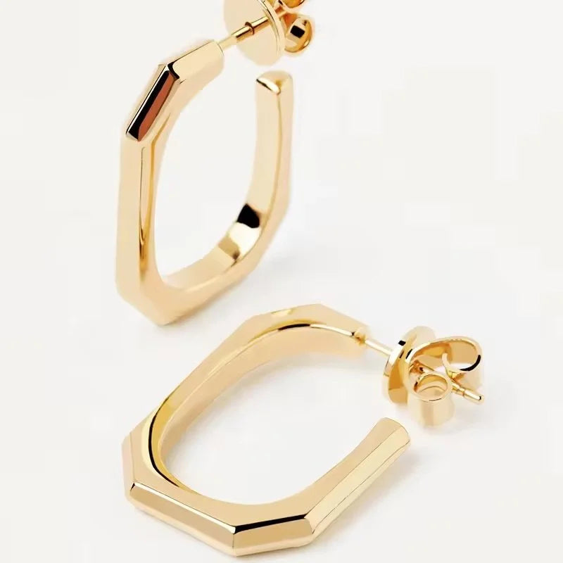 Gold geometric Square hoop earrings with a faceted, stepped edge design, shown on a clean white background.