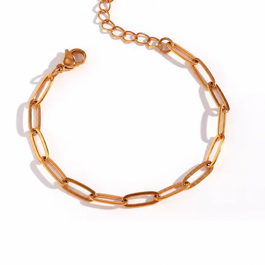 A gold paperclip chain bracelet with a lobster clasp, displayed on a clean white background.