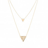 A double-layered gold necklace set featuring a delicate chain with a small triangle pendant and a longer chain with a larger, faceted triangle pendant, displayed on a clean white background.