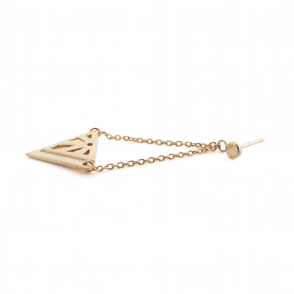 A gold Rise earring laying on its side. Features a triangle pendant suspended from a delicate chain with a small round stud and post, shown on a plain white background.