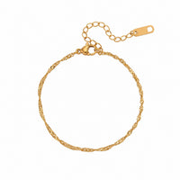 A gold chain bracelet with a twisted rope texture, a spring-ring clasp, and an adjustable extension chain with a lobster clasp, shown on a plain white background.